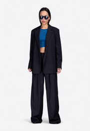 Model wearing black notch lapel blazer, East Vibe